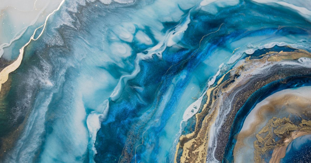 Abstract swirl of deep blue, teal and gold